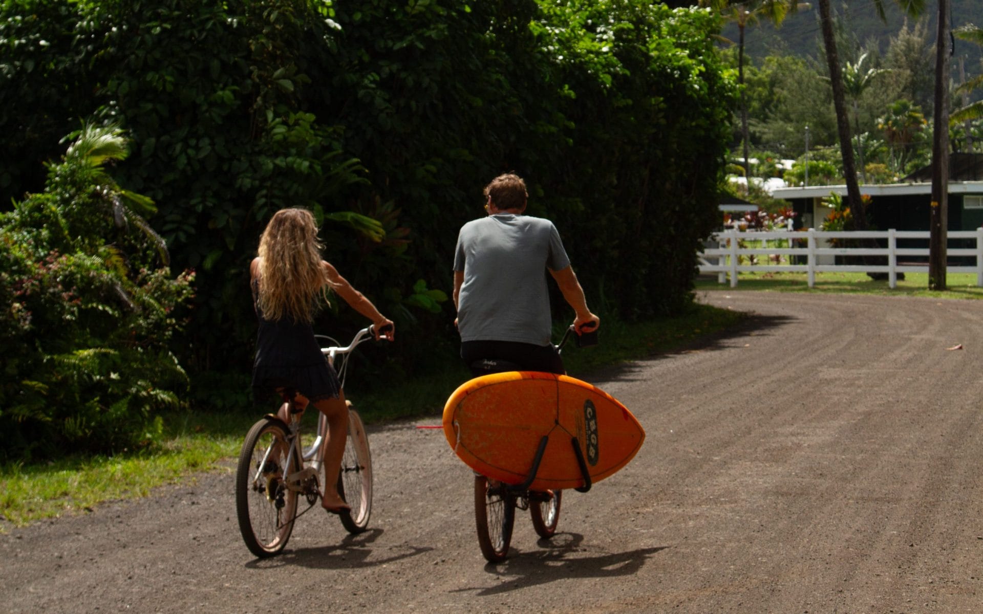 A man and women cycling on the road